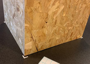Light-colored floor marking sticker sheet partially visible on the ground