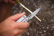 Leatherman Sidekick multi-tool in hand with blade extended