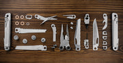 Leatherman Wave+ multi-tool accessories laid out, including blades and drivers