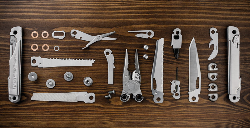 Leatherman Wave+ multi-tool accessories laid out, including blades and drivers