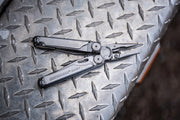 Leatherman Wave+ logo on textured multi-tool handle close-up