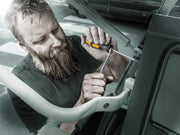 Wera chiseldriver held in hand while working in a vehicle engine area