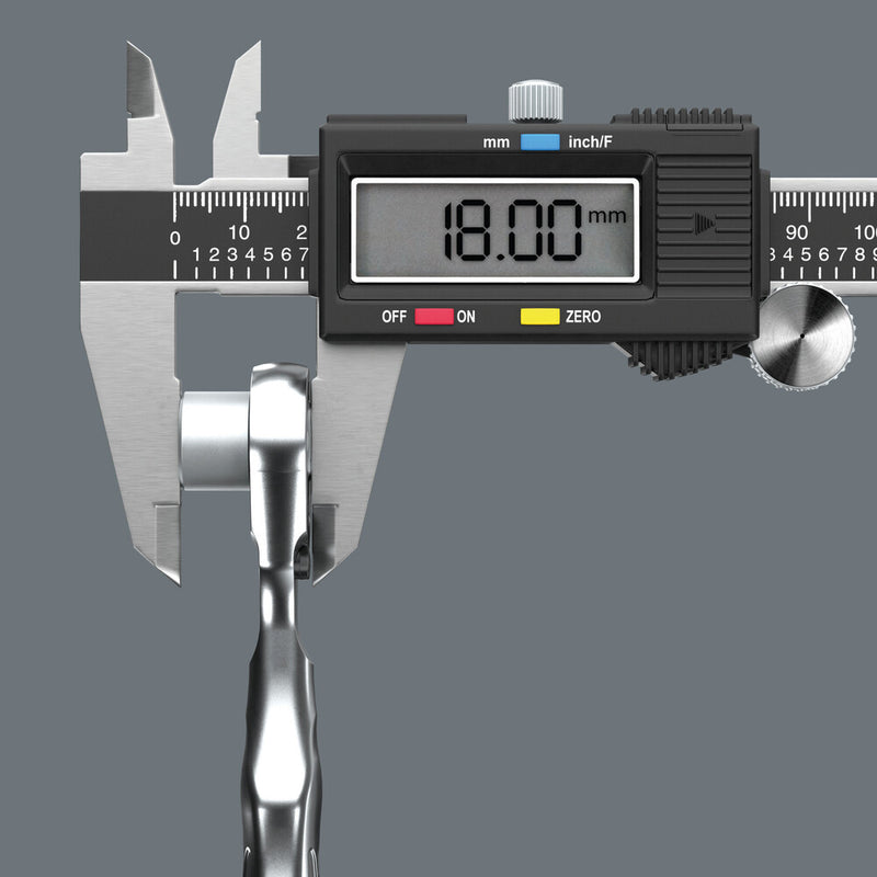 Digital caliper measuring the ratchet tool width in millimeters